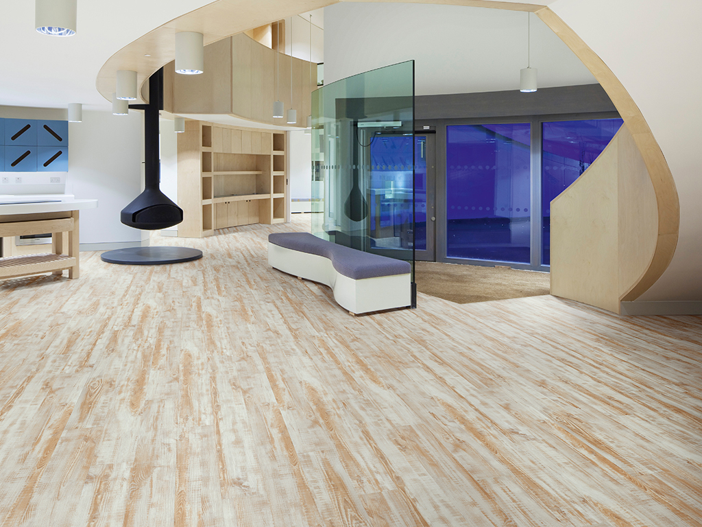 Maggie's Cancer Caring Centre, South West Wales, Swansea, United Kingdom. Architect: Kisho Kurokawa Associates, Garbers & James, 2011. View of the entrance showing the central space with suspended fir