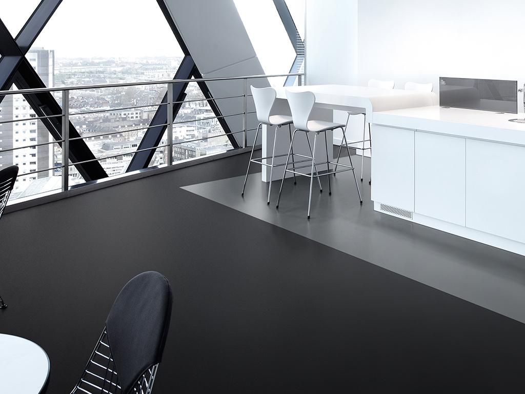 Office space at 30 St Mary Axe (the Gherkin), London, United Kingdom. Architect: Michael O'Sullivan, 2012. Break-out / kitchen space with bespoke units.