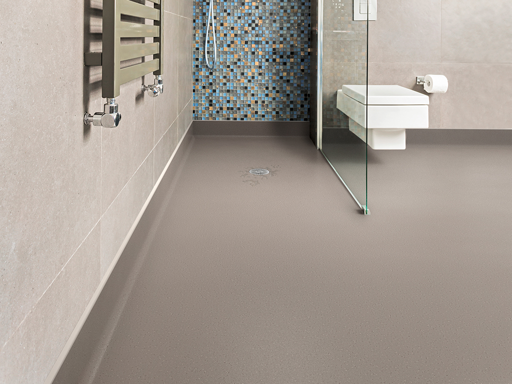 Modern and grey bathroom with shiny tiles and white lavatory